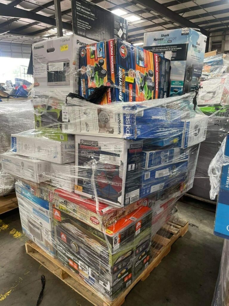 reseller inspecting liquidation pallets