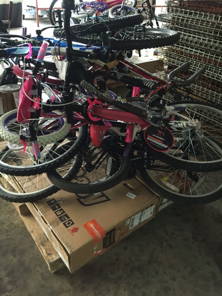 reseller inspecting bicycle pallets