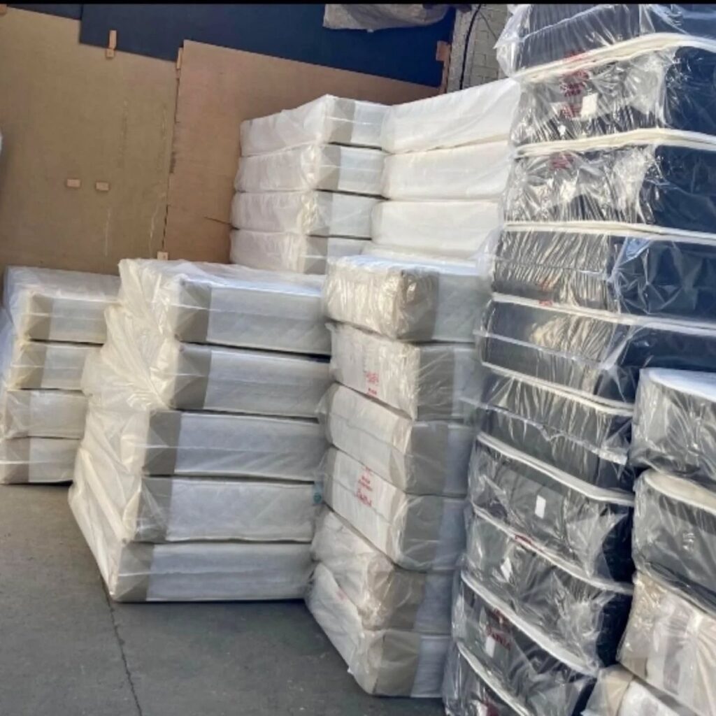 reseller inspecting mattress pallets