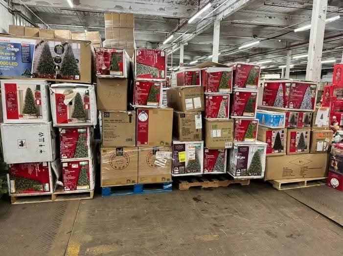 reseller inspecting Christmas pallets